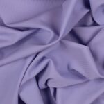 Tessuto Lycra Opaca. Si tratta di un materiale creato apposta per aderire alla figura corporea. Elastico e allungabile è dunque molto usato nel mondo dello sport