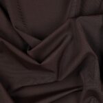 Tessuto Lycra Opaca. Si tratta di un materiale creato apposta per aderire alla figura corporea. Elastico e allungabile è dunque molto usato nel mondo dello sport