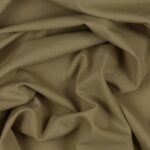 Tessuto Lycra Opaca. Si tratta di un materiale creato apposta per aderire alla figura corporea. Elastico e allungabile è dunque molto usato nel mondo dello sport