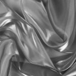 Dettaglio organza lucida grigio - trasparenza e riflessi