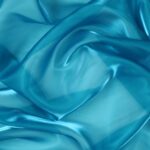 Dettaglio organza lucida turchese scuro - trasparenza e riflessi
